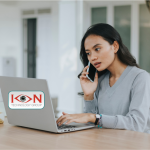 Woman on phone with computer that has ION Technology group logo on it